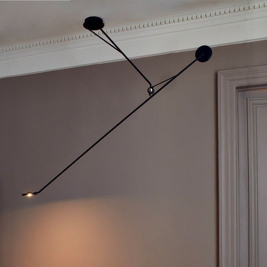DWC Editions Aaro ceiling light illuminated with mink coloured walls