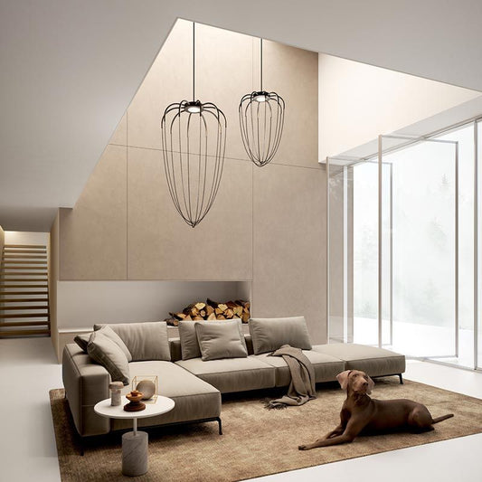 Axo Light Alysoid Pendant with black beads hanging in lounge with a dog on the carpet