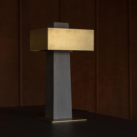 DCW Editions Iota table lamp in brass and bronze unlit on dark table
