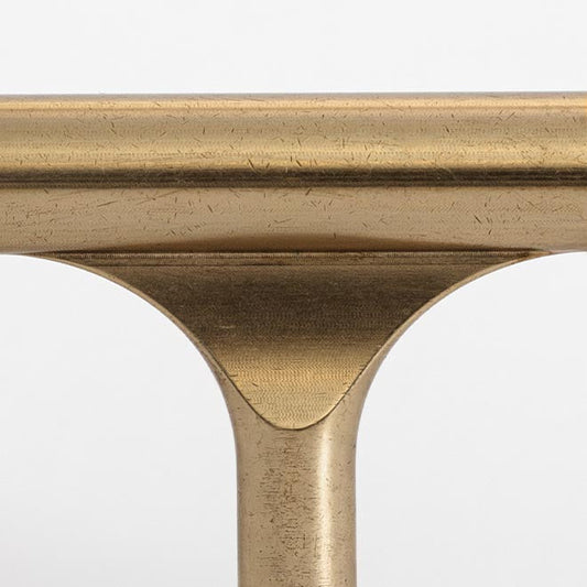 Close-up of a gold metal object with a white background