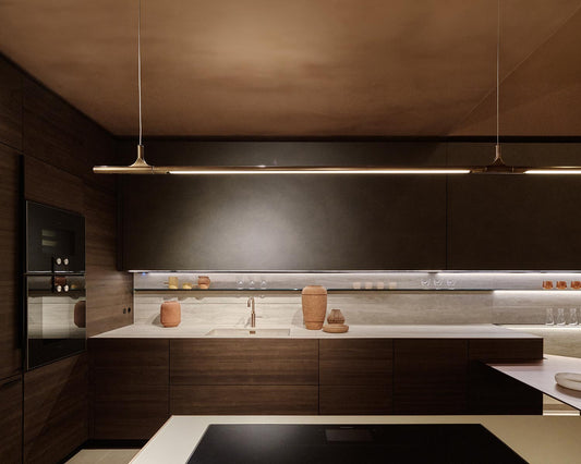 Modern kitchen with dark wood cabinets and a sleek design.