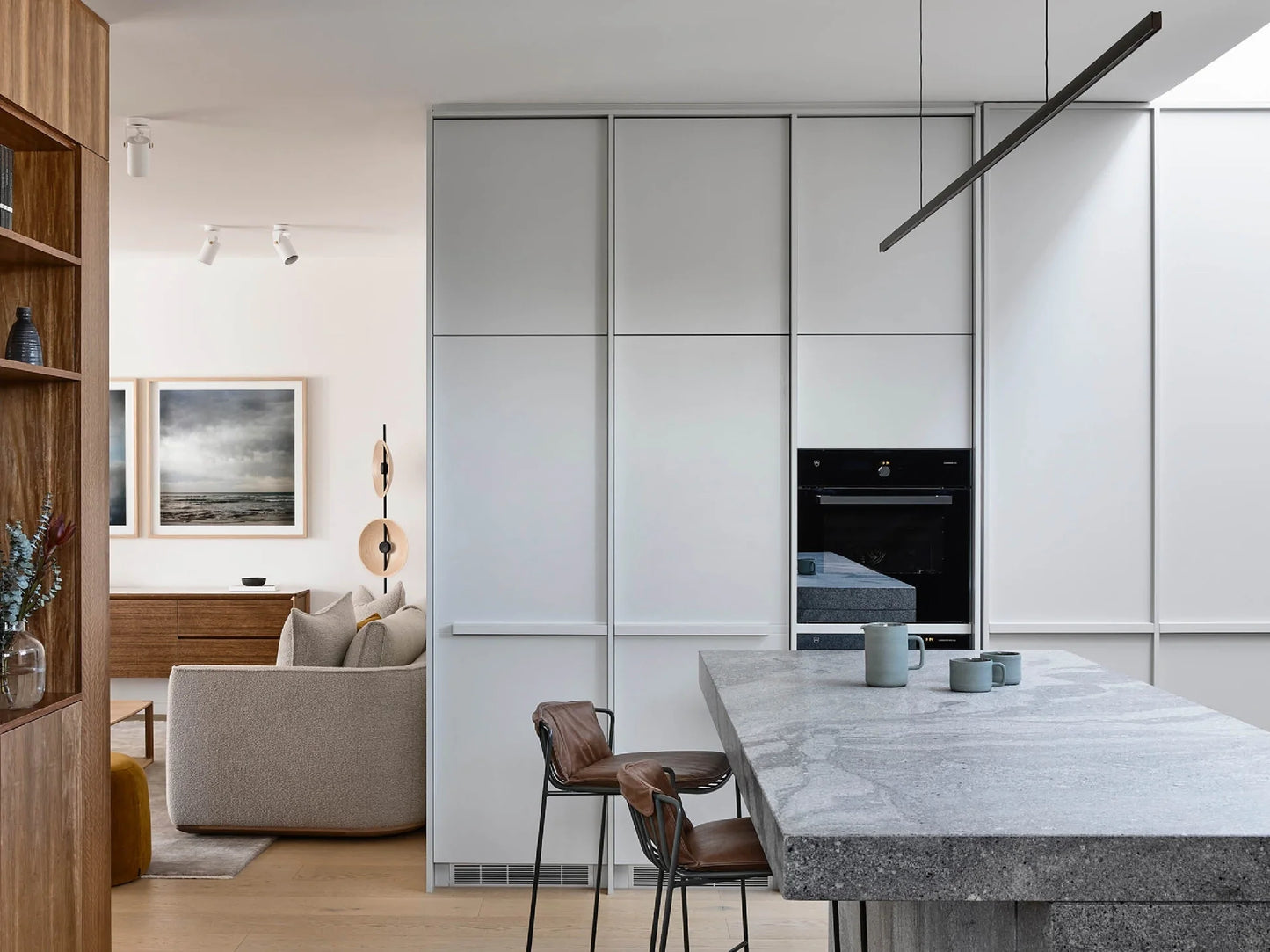 Highline Linear Pendant in Black over Grey Marble Kitchen Island