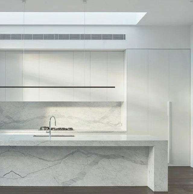 Highline Linear Pendant in Black over White Marble Kitchen Island
