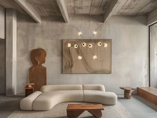 DCW Editions Munari pendant with 10 illuminated acrylic spheres and curved rods in lounge curved sofa, wooden side tables, ceiling beams and art