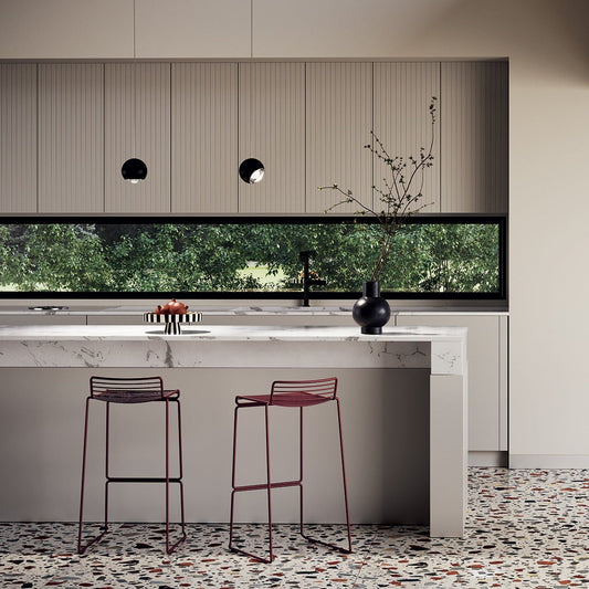 Lodes Spider pendant in black finish over modern kitchen island with bar stools