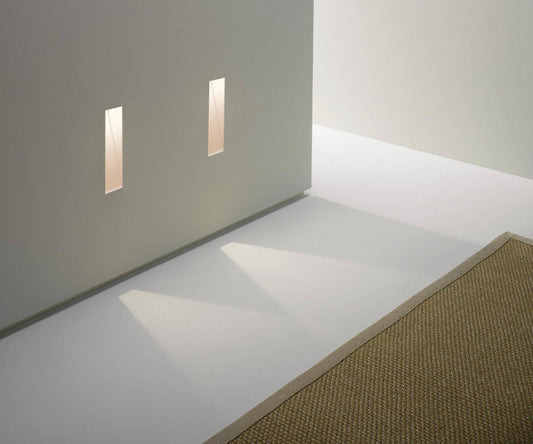 Astro Borgo step light trimless vertical 35 on grey wall shining onto floor with rug