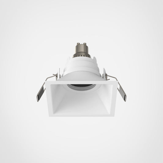 White recessed ceiling light on a gray background