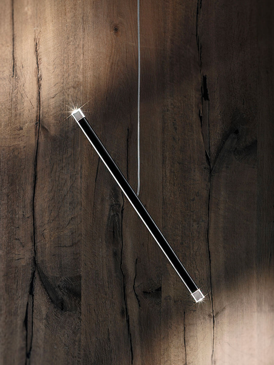 Lodes A-Tube Nano Duo black gloss against wooden wall