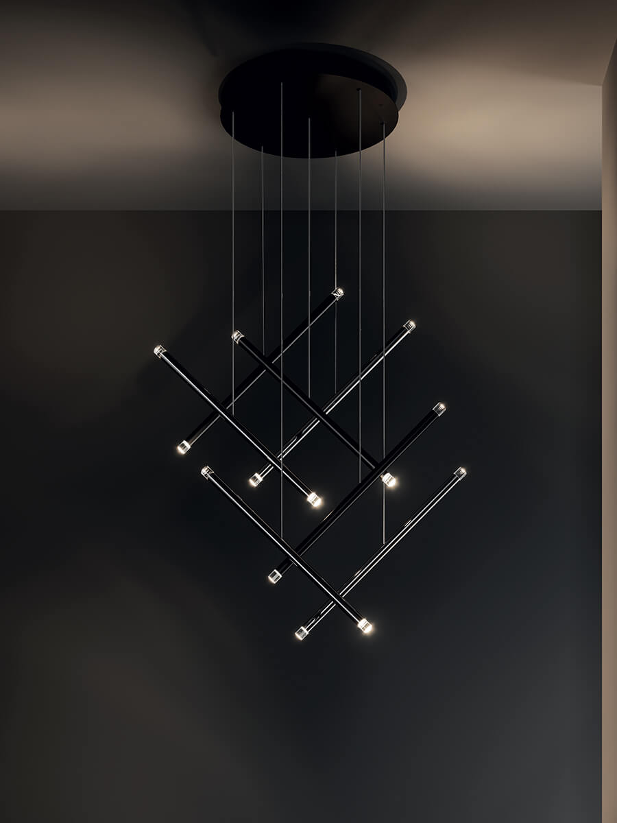 Lodes A-Tube Nano Duo black in a cascading cluster on a dark background