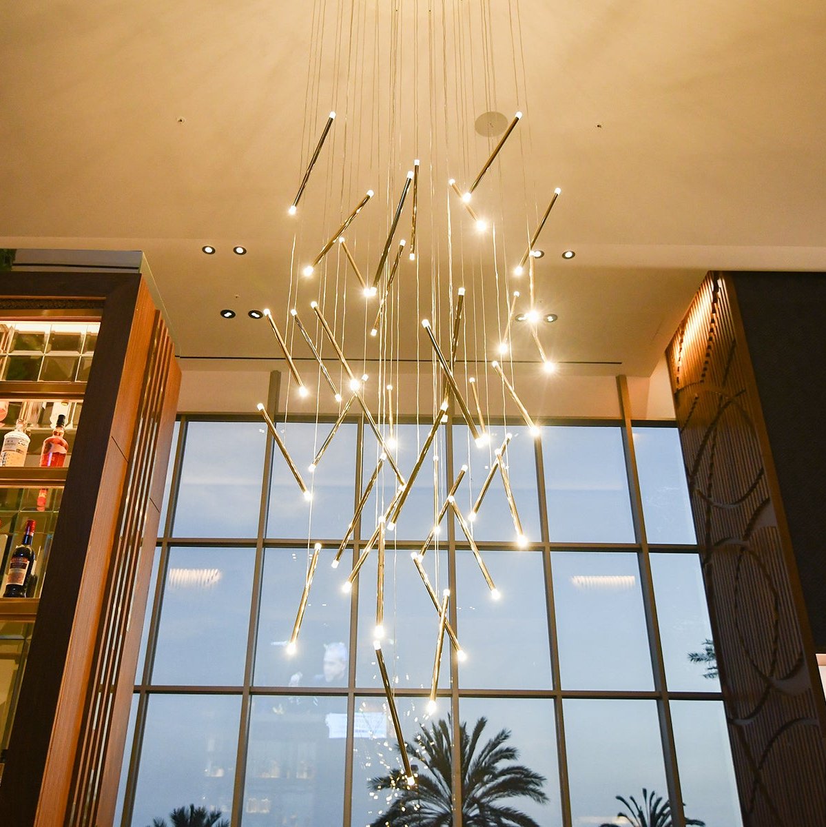 Lodes A-Tube Nano Duo in a cascading cluster in front of a tall window