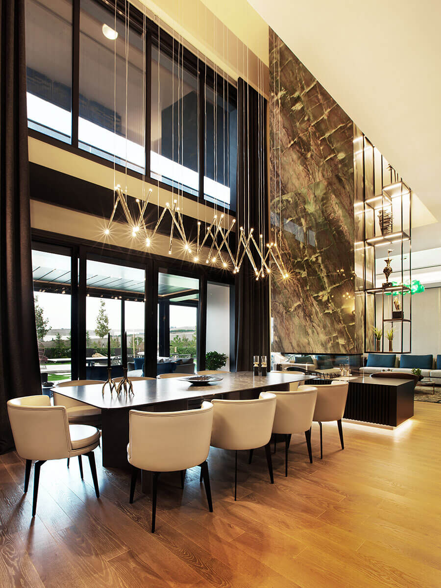 Lodes A-Tube Nano Duo over long dining table with high ceilings
