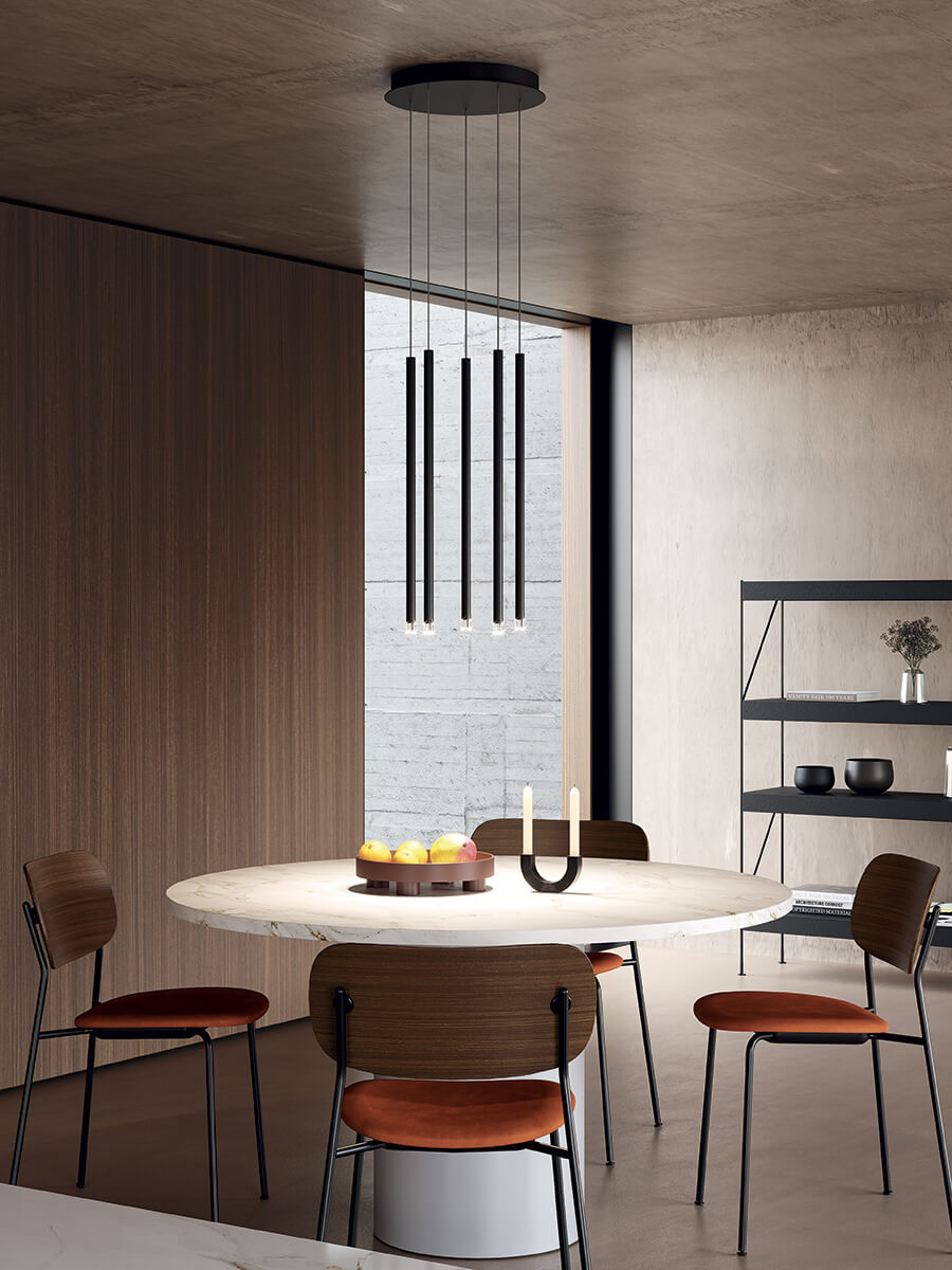Lodes A-Tube Nano pendant over white, round table with chairs