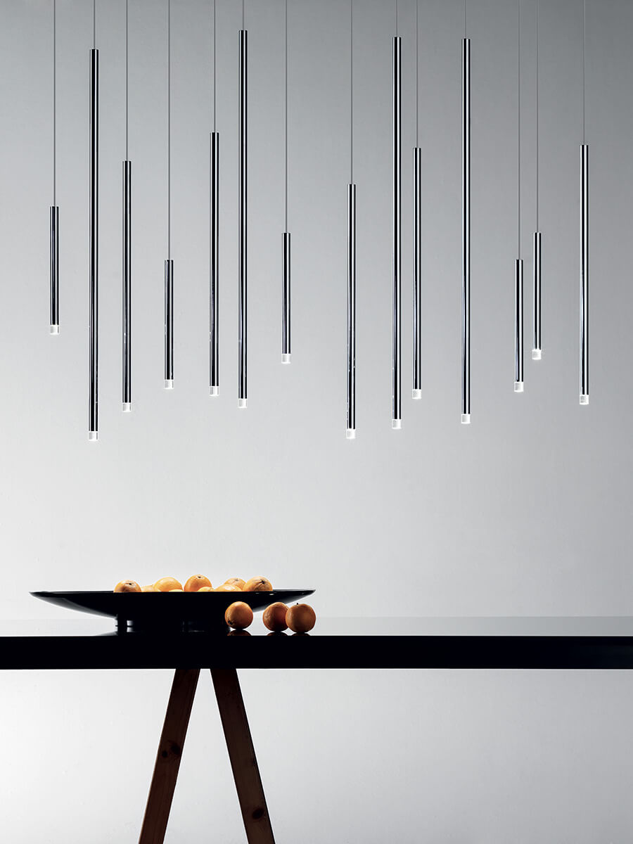 Lodes A-Tube Nano pendants in chrome over black table