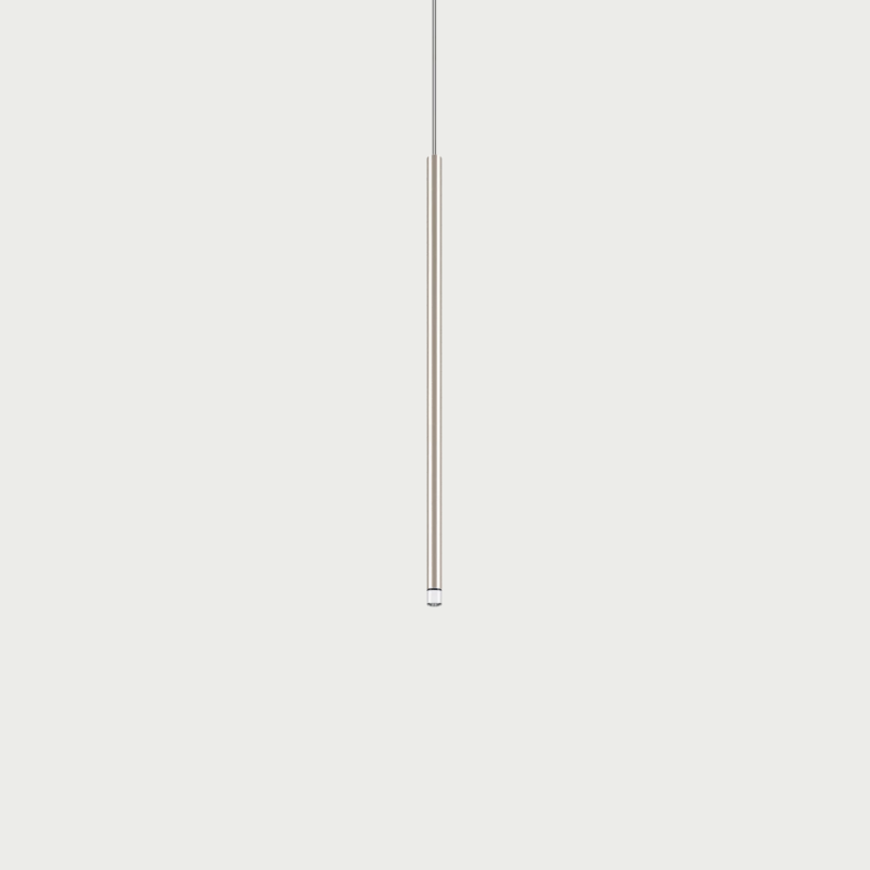 Lodes A-Tube Nano medium pendant in champagne with grey background and clear cable