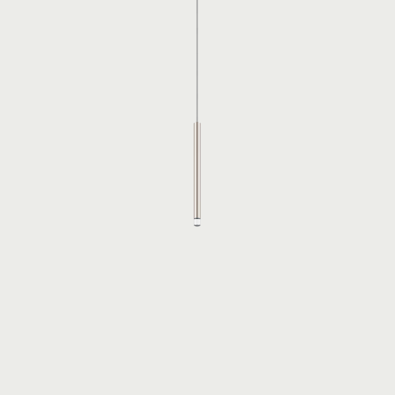 Lodes A-Tube Nano small pendant in champagne with grey background and clear cable