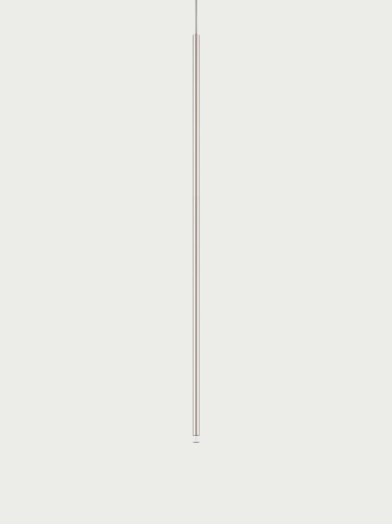 Lodes A-Tube Nano XL pendant in champagne with grey background and clear cable