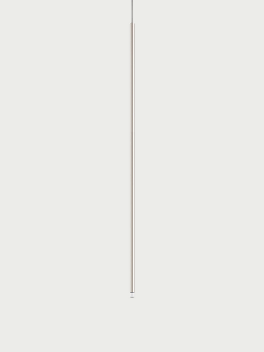 Lodes A-Tube Nano XL pendant in champagne with grey background and clear cable