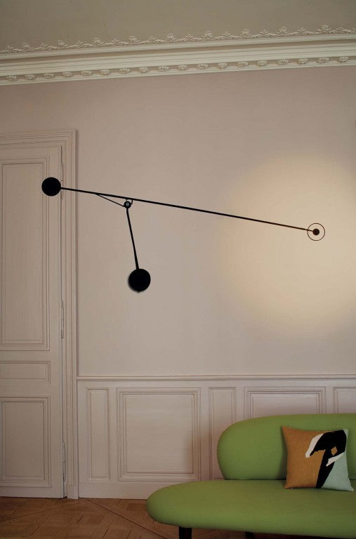 DWC Editions Aaro wall light in lounge with green sofa