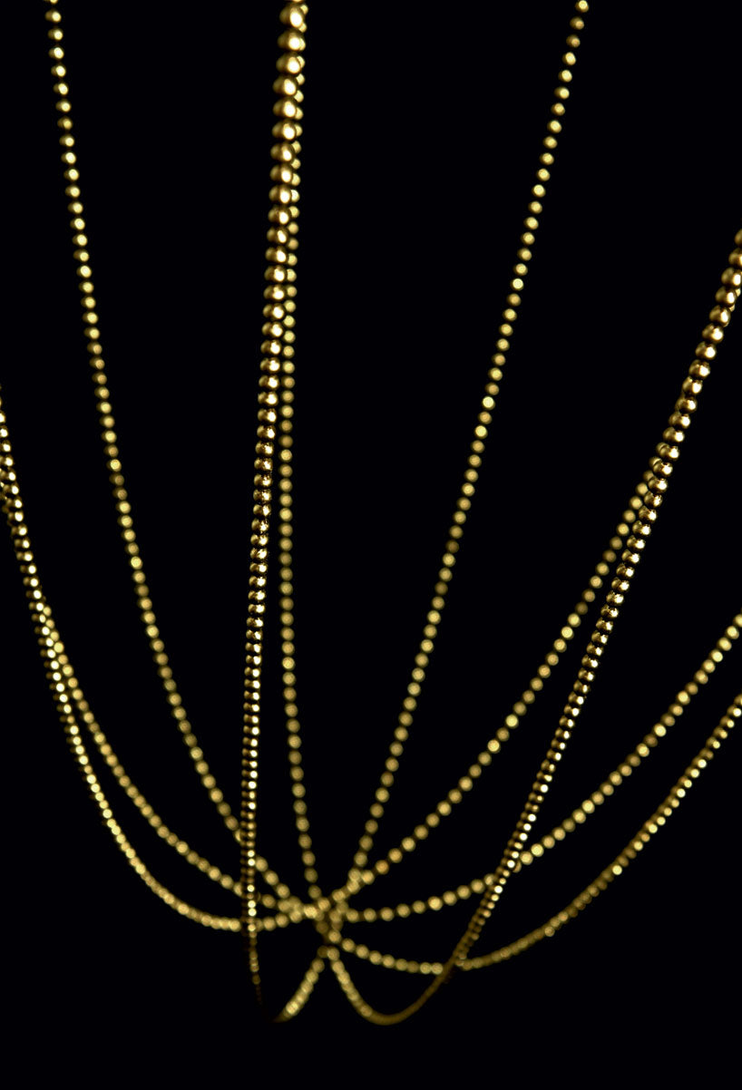 Axo Light Alysoid Pendant brass beads on a black background