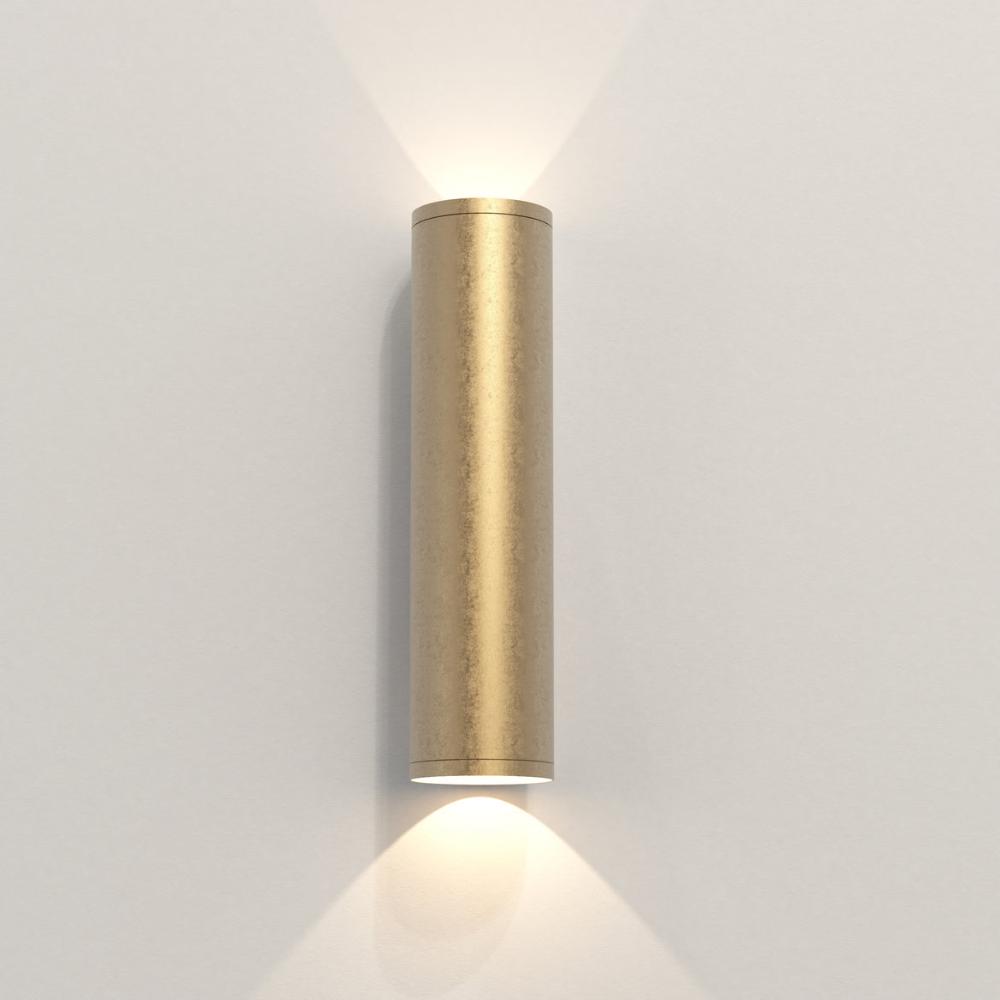 Cylindrical wall light fixture on a plain wall