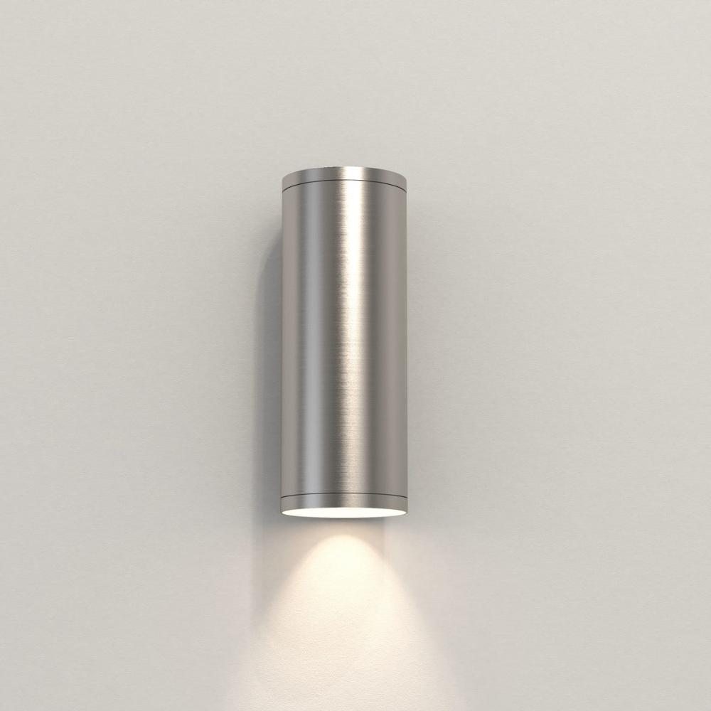 Cylindrical wall light fixture on a plain background