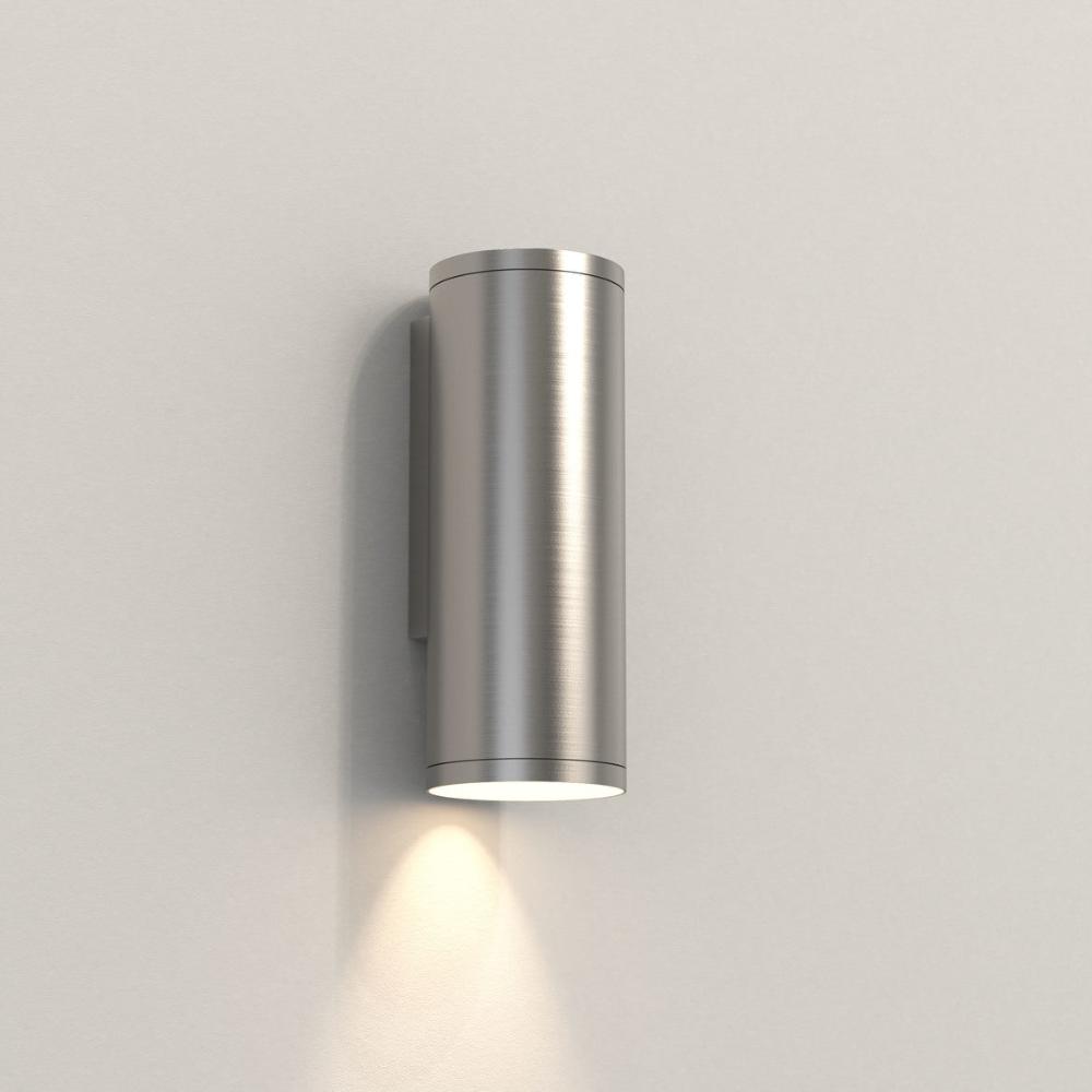 Metallic outdoor wall light fixture on a plain background