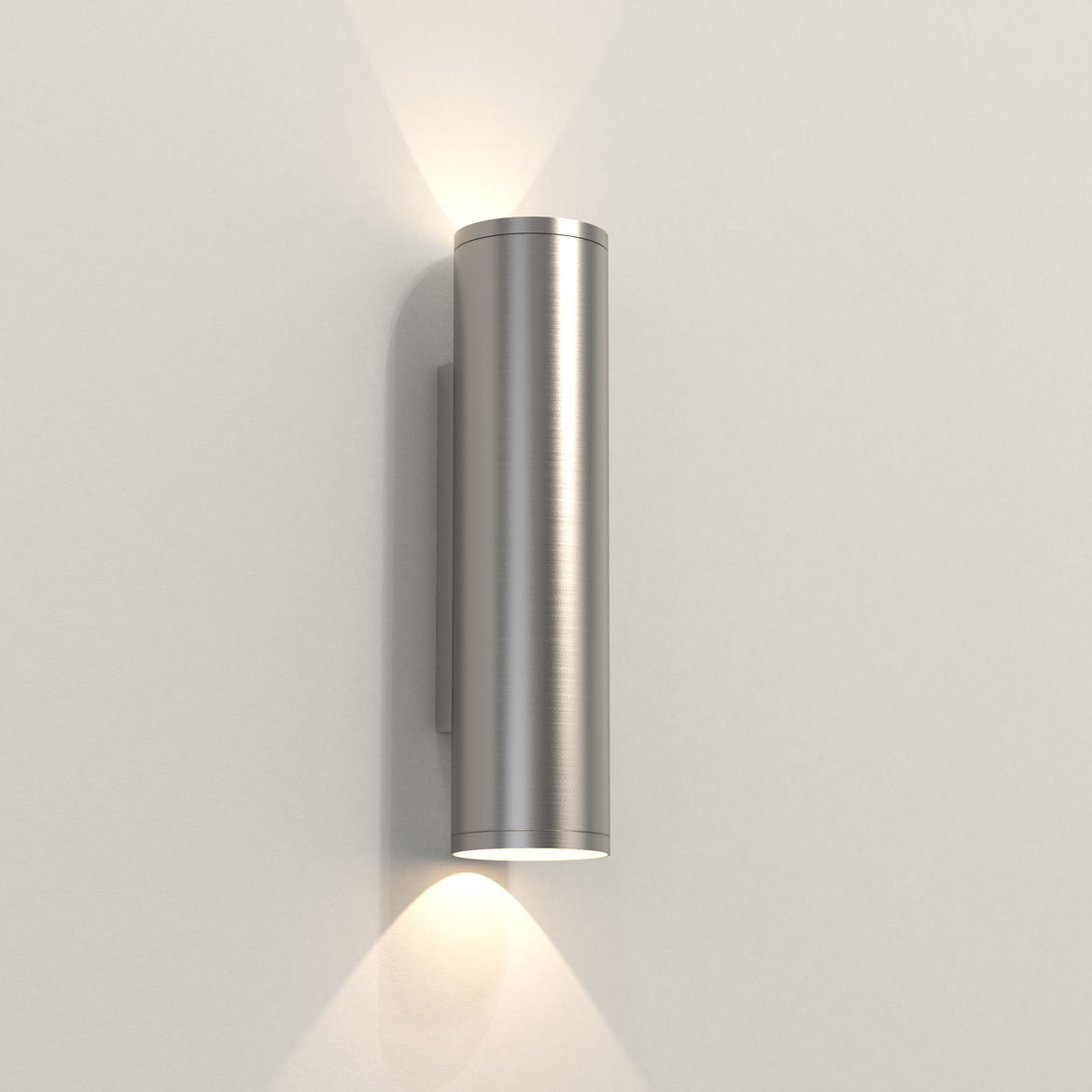 Cylindrical wall light fixture on a plain wall