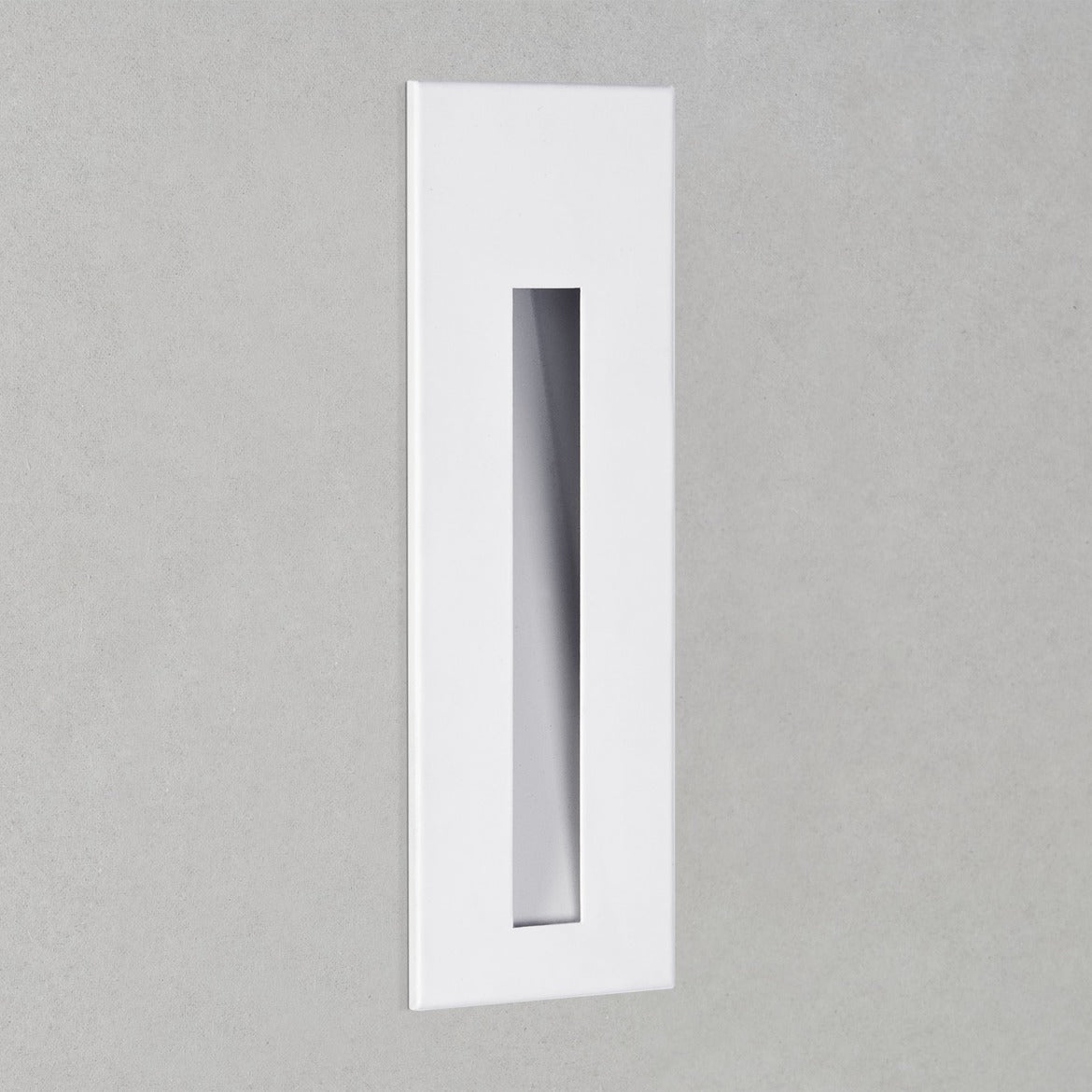 Rectangular white light fixture on a gray background