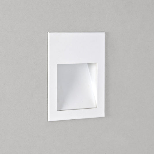 Square recessed light fixture on a gray wall