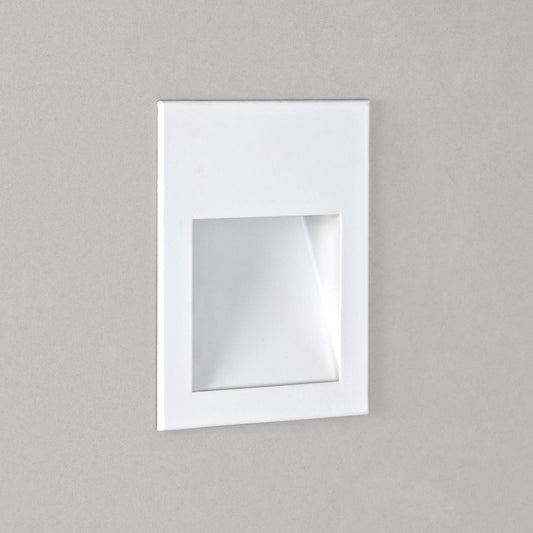 Square mirror with white frame on a gray background