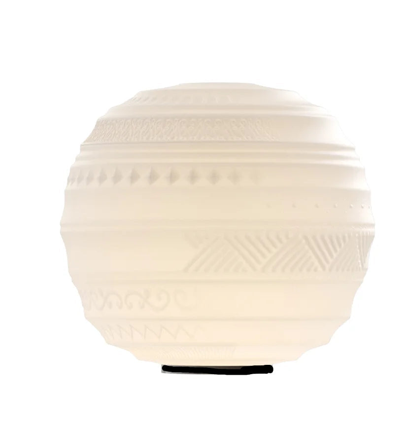 Round textured table lamp on a white background