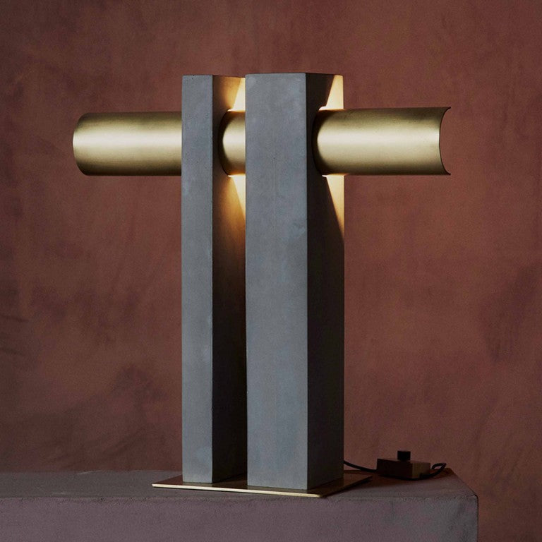 DCW Editions Pi table lamp in brass and bronze with red wall