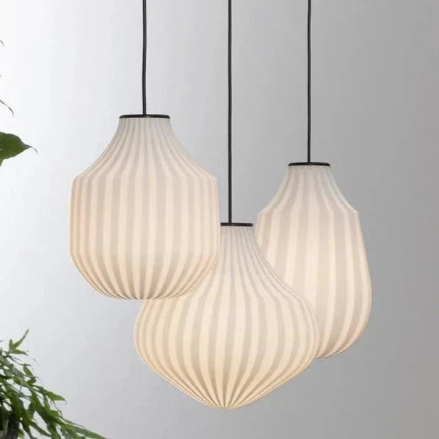 Karman Italia Circus pendants in a tight group with a plant