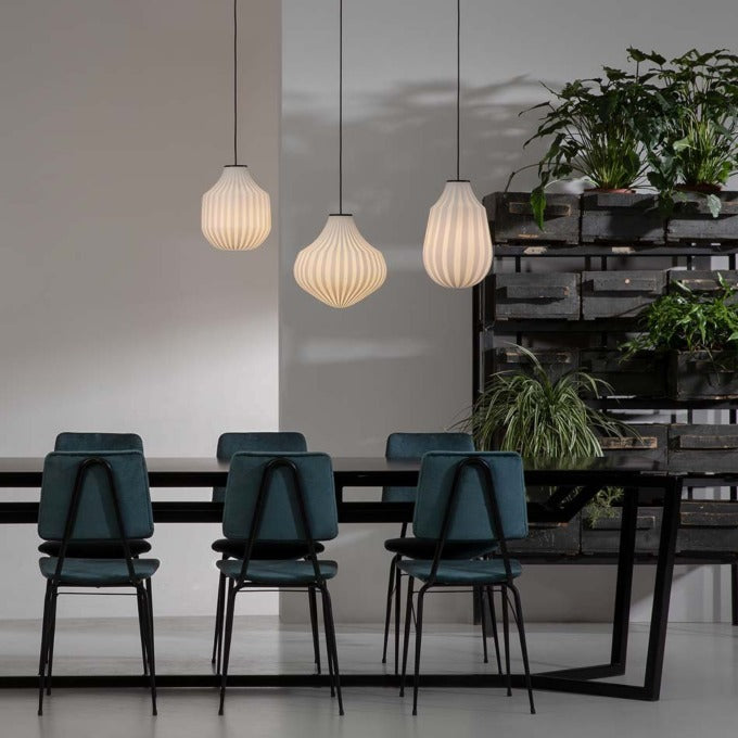 Karman Italia round Circus pendants hanging at different heights over a long table