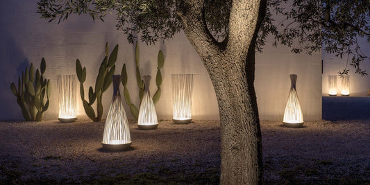 Don't Touch outdoor floor lamps in garden with cacti
