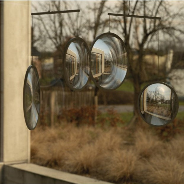DCW Editions black Focus pendant with 4 circles in window