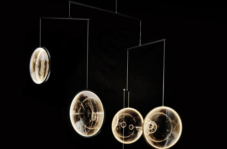 DCW Editions black Focus pendant with 4 circles on black background
