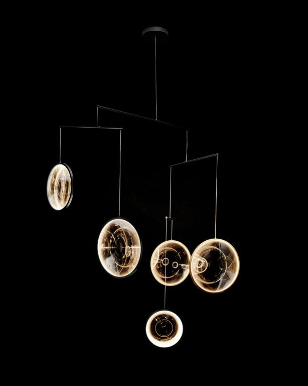 DCW Editions black Focus pendant with 5 circles on black background