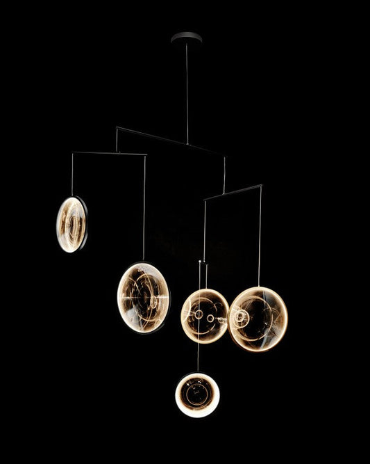 DCW Editions black Focus pendant with 5 circles on black background