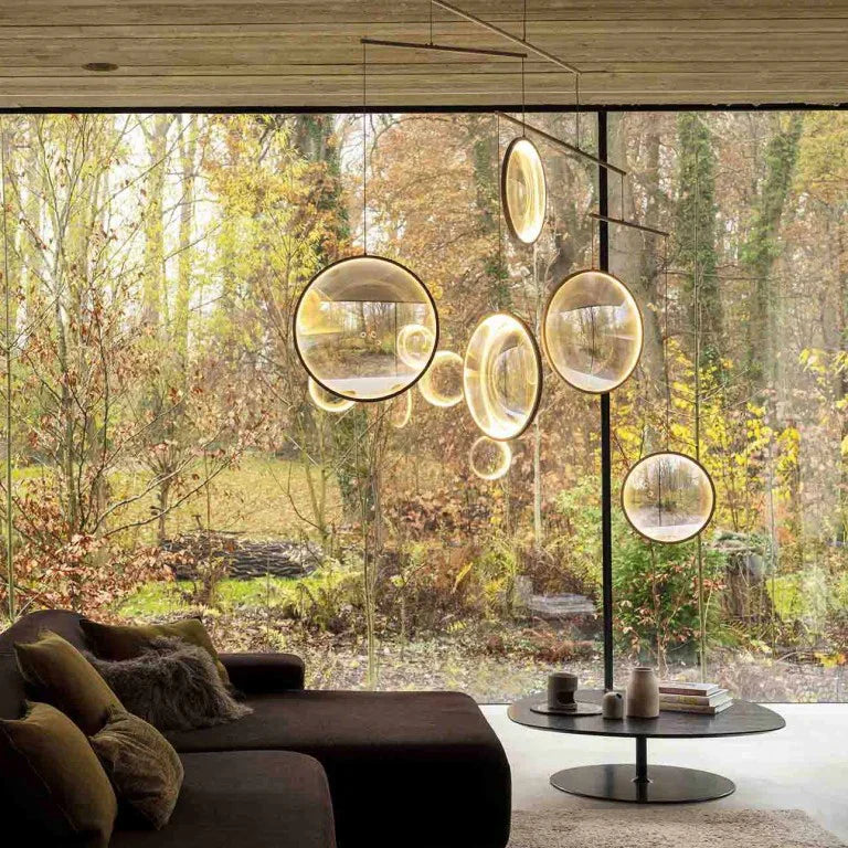 DCW Editions gold Focus pendant with 45circles in lounge with large picture window