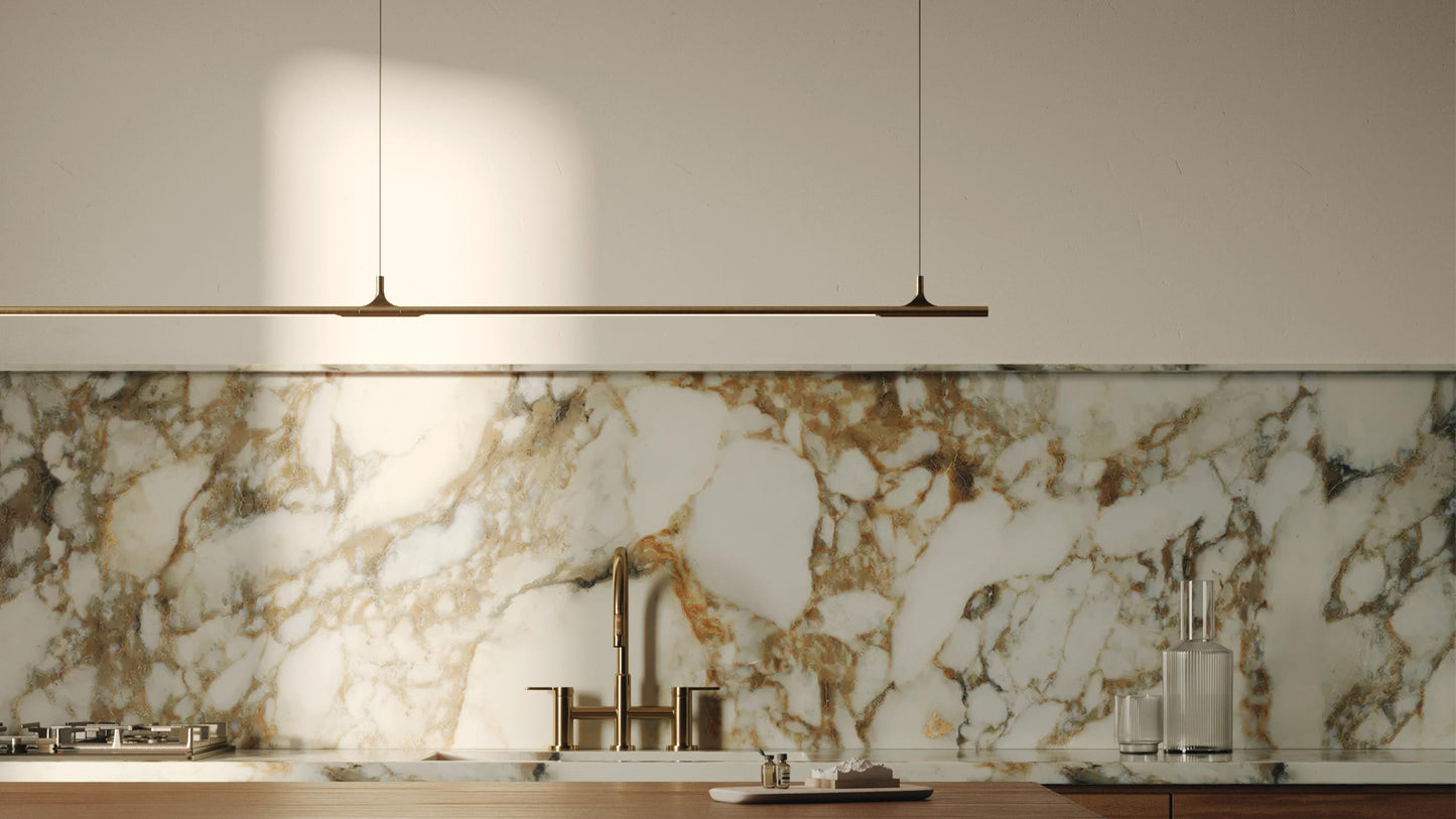 Marble backsplash with modern kitchen fixtures in a neutral setting