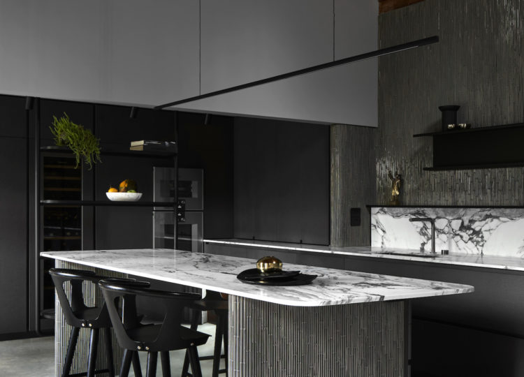 Highline Linear Pendant in Black over Marble Kitchen Island with Dark Grey Woodwork