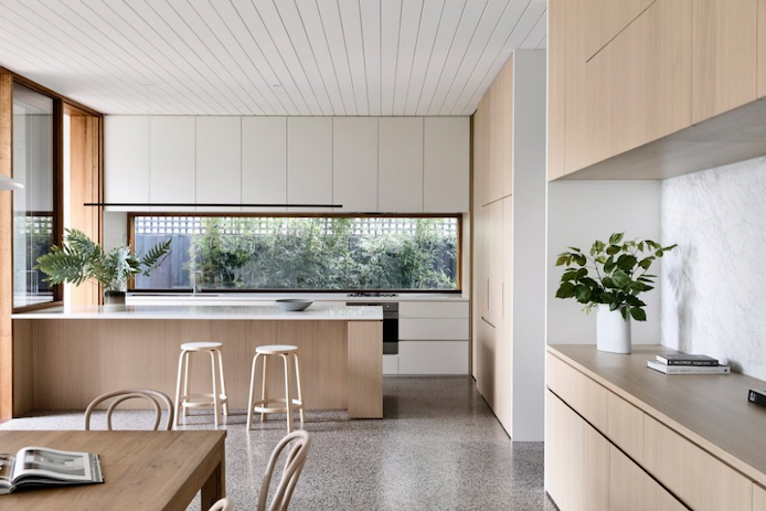 Highline Linear Pendant in Black over White and Light Wood Kitchen Island