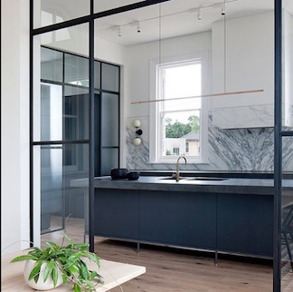 Highline Linear Pendant in Brass over Black and Grey Kitchen Island with Crittall Doors