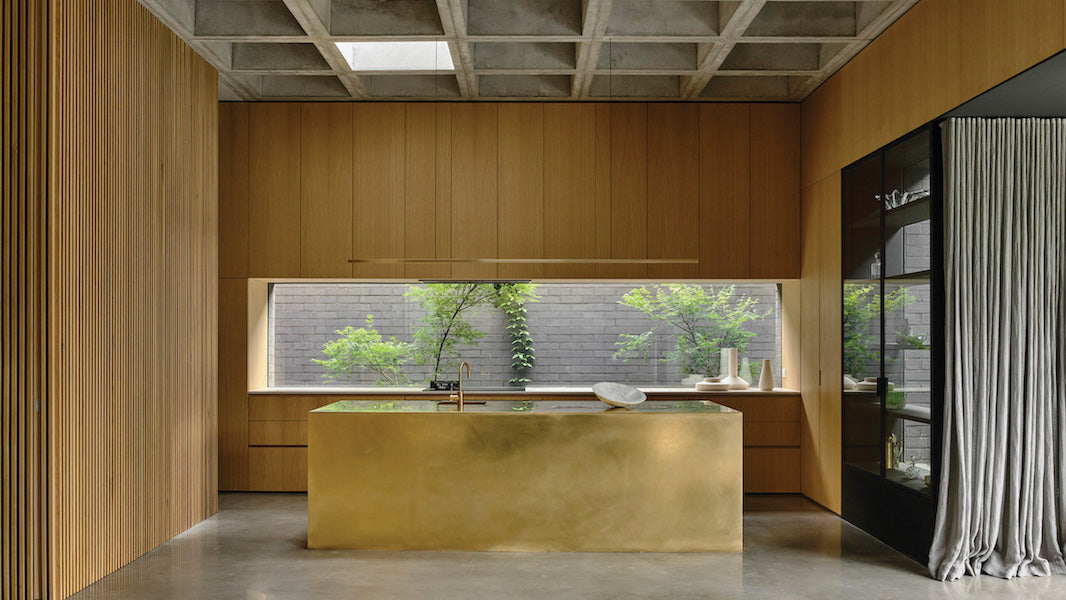 Highline Linear Pendant in Brass over Brass Kitchen Island