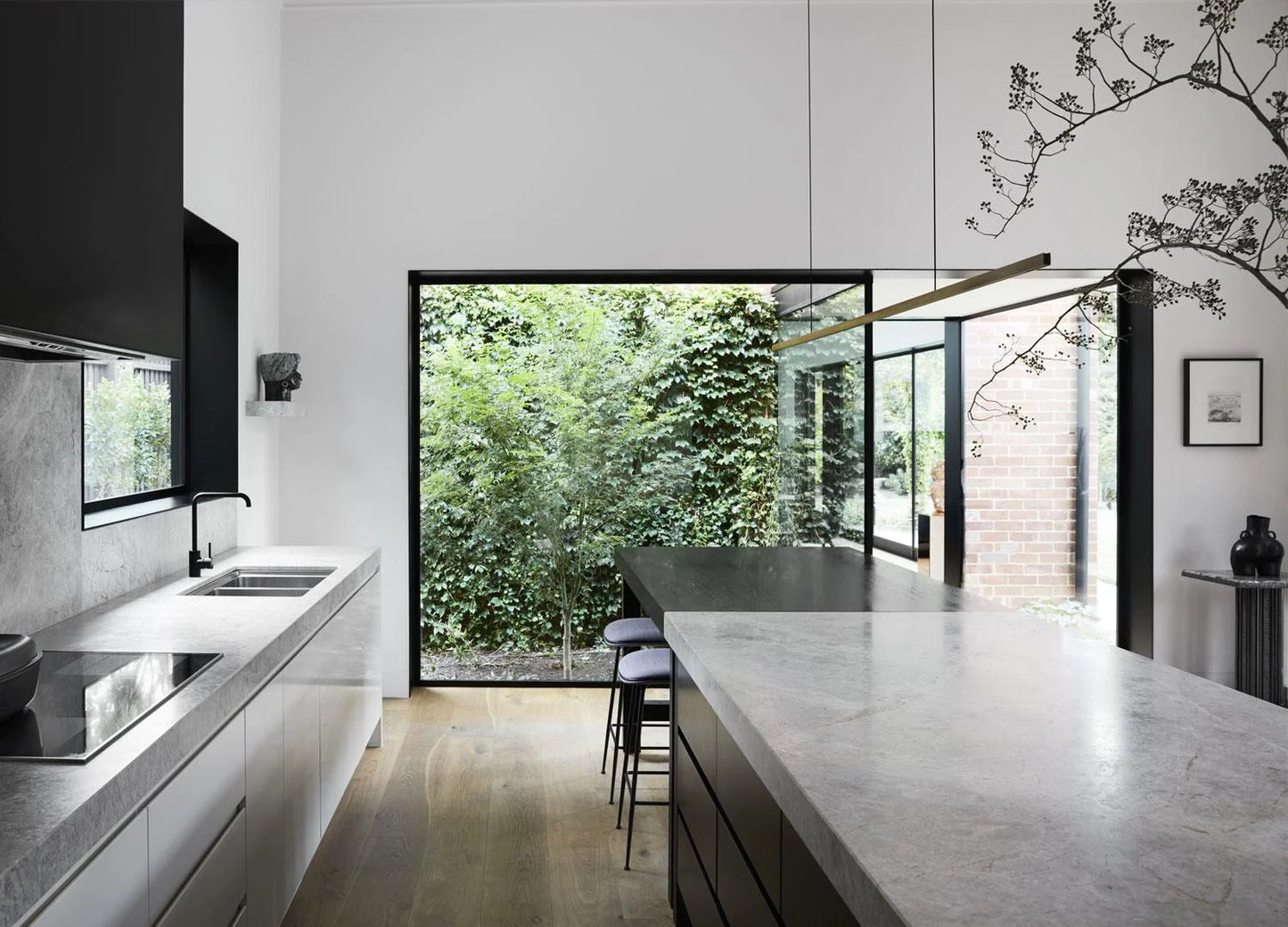 Highline Linear Pendant in Brass over Kitchen Island with Breakfast Table