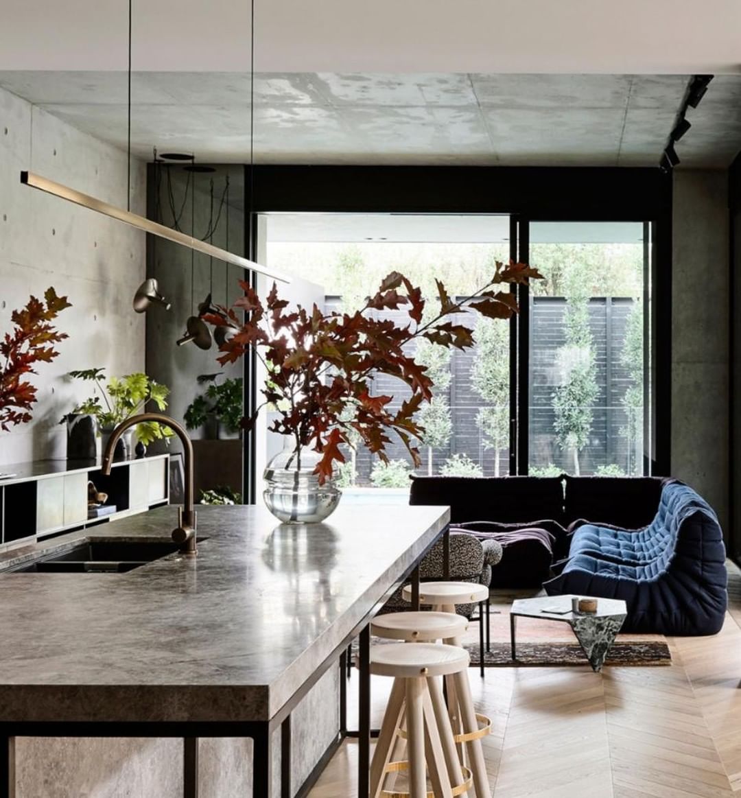 Highline Linear Pendant in Brass over Polished Concrete Kitchen Island