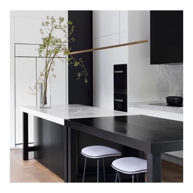 Highline Linear Pendant in Brass with Black and White Kitchen