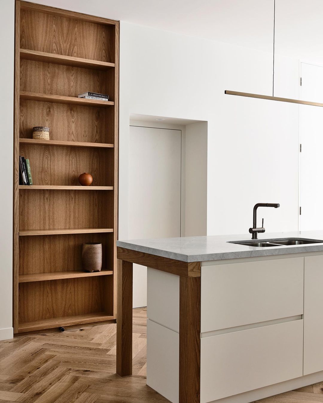 Highline Linear Pendant in Patina Brass over Modern Kitchen Island