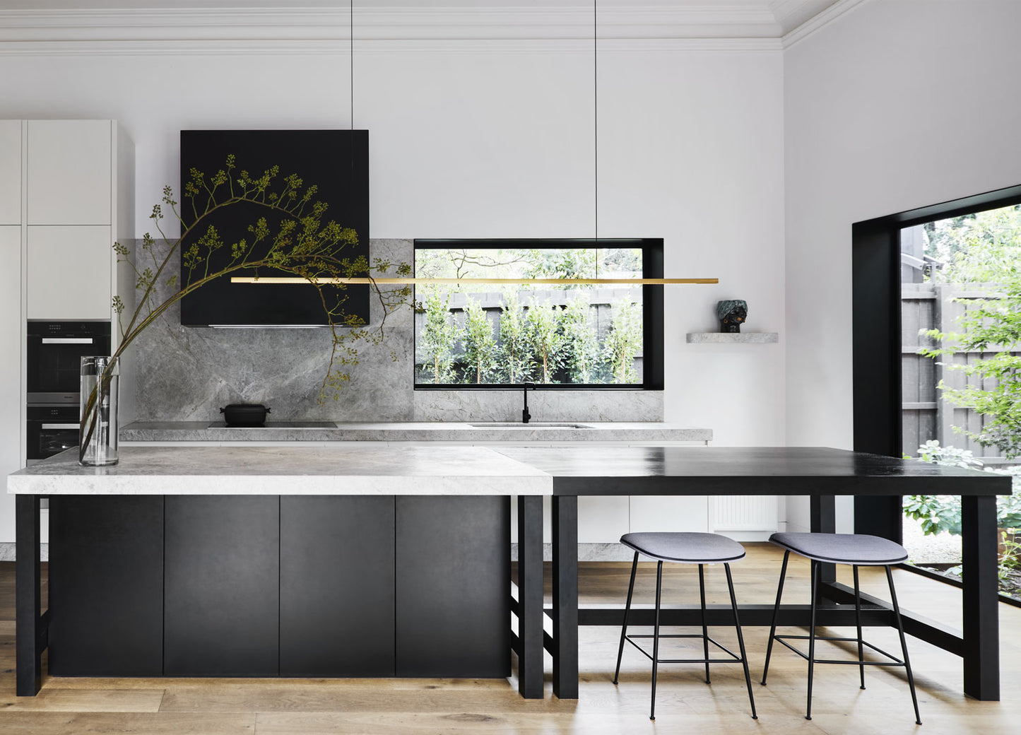 Highline Linear Pendant in Satin Brass with Walnut over Kitchen Island and Breakfast Table